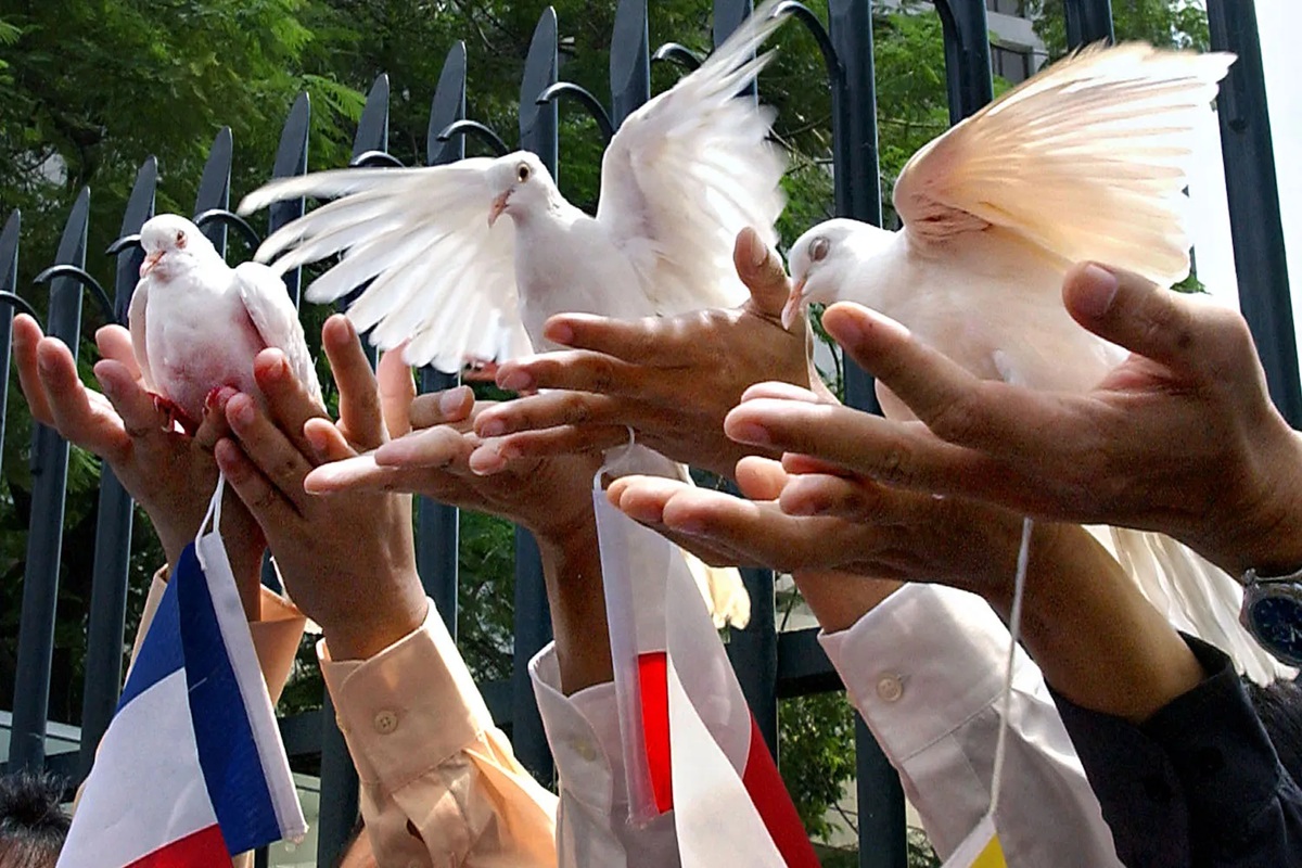 Indonesian Muslim demonstrators let loose doves as a symbol of peace in Jakarta, Indonesia, on Feb. 7, 2003. Choo Youn-Kong/AFP
