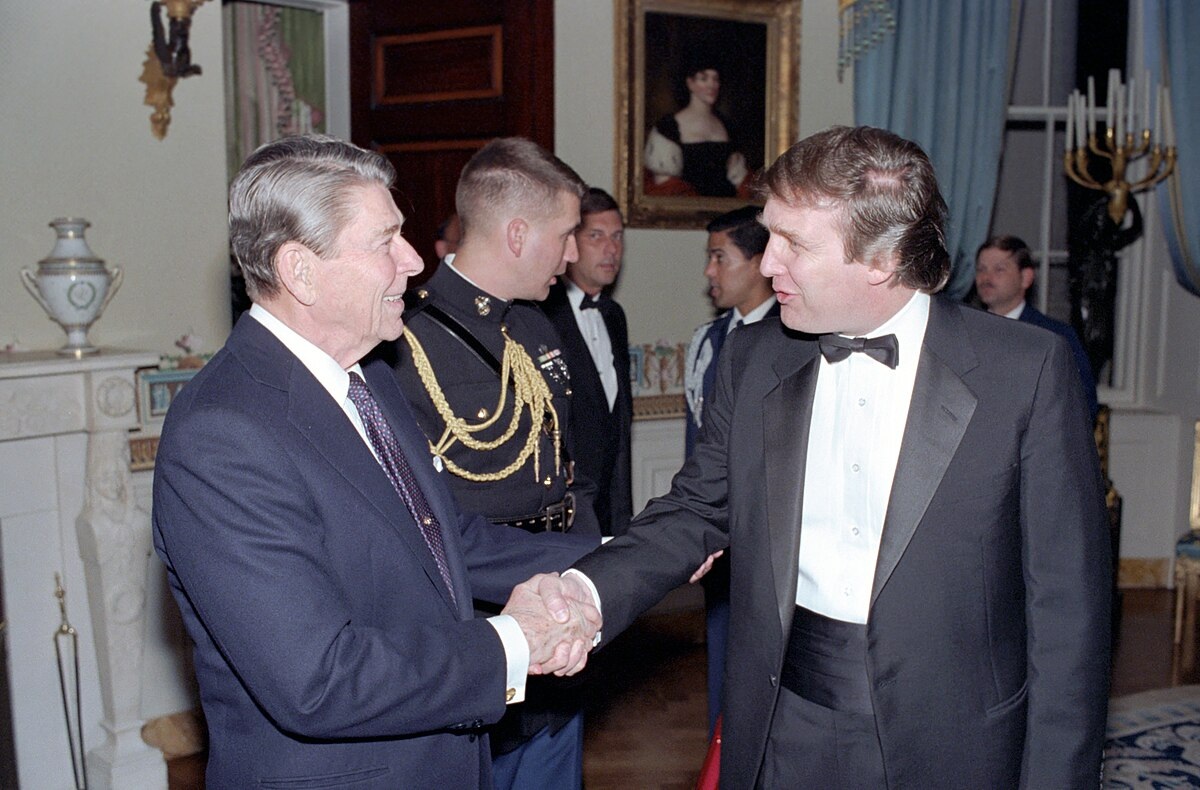 11/3/1987 President Reagan shaking hands with Donald Trump at a reception for members of the "Friends of Art and Preservation in Embassies" Foundation in the Blue Room